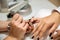 Manicure process in beauty salon, close up