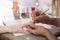 Manicure process. Woman works on younger girl`s hands and nails. Close-up.