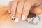 Manicure salon, nail design on shiny nail. Fashionable multicolored manicure. Professional manicure in beauty salon
