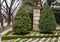 Manicured garden with small hedge, Kale and bushes with small red berries outside a mansion in Dallas, Texas