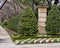 Manicured garden with small hedge, Kale and bushes with small red berries outside a mansion in Dallas, Texas