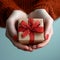 Manicured gesture Womans hands delicately hold a red gift