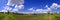 Manicured Mowed Grass on Baseball Field Diamond with Blue Sky and Clouds