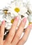 Manicured nails with natural nail polish. Manicure with pink nailpolish. Fashion manicure. Shiny gel lacquer. Spring