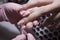 The manicurist applies a layer of gel Polish to the client`s nail.