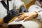 Manicurist with black protective mask work on a woman client hands, Professional works in gloves for sterility