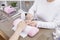 Manicurist cleaning the nail before starting the gel polish treatment