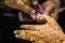 Manicurist doing manicure to indian bride hand lacquer polish, painting fingernails,