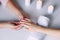 Manicurist hands doing massage to female client`s hands. Woman hand receiving manicure procedure. Spa salon. Beautiful