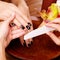 Manicurist master makes manicure on woman\'s hands