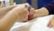 Manicurist master in salon cover nails