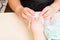 Manicurist Performing Paraffin Wax Treatment