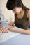 Manicurist polishing client\'s nails