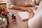 Manicurist shaping female clients nails at beauty salon