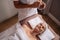 Manicurist shaping nails of client in salon