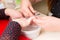 Manicurist Trimming Cuticles During Manicure