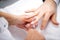 Manicurist using cuticle scissors for nail treatment