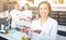 Manicurists with palette of nail polish