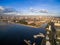 Manila Cityscape in Philippines. Blue Sky and Sunset Light. Pier in Foreground.