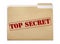 A manila folder with the faded words Top Secret on
