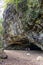 Maniniholo Dry Cave on Kauai Island, Hawaii. People exploring the cave.