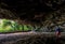 Maniniholo Dry Cave on Kauai Island, Hawaii. People exploring the cave.