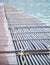 Manmade synthetic plastic pipe floating pontoon for supporting a variety of marina dock systems including harbors, flotation docks