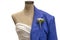 Mannequin with formal dress on one side and suit with buttonhole flower on the other side for spring wedding or prom - closeup and