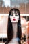 Mannequin head display with a long neck and a wig