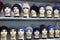 Mannequin heads in knitted hats and scarves. Mannequins female heads in hats and scarfs close up. Woolen knitted caps