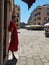 Mannequin with red dress outside a shop in a Venetian square