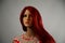 Mannequin with red hair in a red and white polka dot dress
