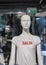 Mannequin in a white T-shirt with the sign Sale