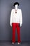 Mannequin in white women sweater and red trousers.