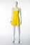 Mannequin in a yellow summer dress and beige shoes with heels.
