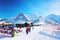 Mannlichen mountain and resort with tourists at winter Swiss Alp