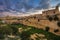 Manoel Island, Malta - Abandoned limestone fortress at the center of Manoel Island with Saint Paul`s Cathedral