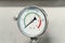 Manometer or pressure gauge on factory equipment close up