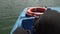 Mans feet spinning pedals on water bicycle on a lake. Spinning boat for tourists, fun summer activity with friends