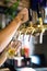 Mans hand pouring pint of beer behind the bar in pub