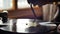 Mans hand turning the handle of the old retro gramophone close-up slow motion shot