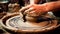 Mans Hands creating pottery