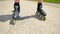 Mans legs roller skating on the asphal. Close up view to quick movement of inline boots.