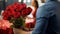 A mans romantic surprise Holding a bouquet of vibrant, fragrant roses