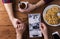 Mans and womans hands. Black-and-white photo. Couple. Tea and cookies.