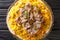 Mansaf is a dish of rice, lamb, and a dry yoghurt made into a sauce called jameed closeup in the plate. horizontal top view