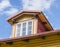 Mansard window in wooden house