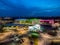 Mansfield Sutton in Ashfield Modern NHS Kings Mill hospital building lit up bright colourful night exterior aerial view drone