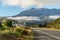 Mansion and empty road to giant mountain, Tongariro National Park,