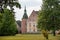 Mansion house and church of Holsteinborg Castle, beuatifully situated among the trees in the big gar